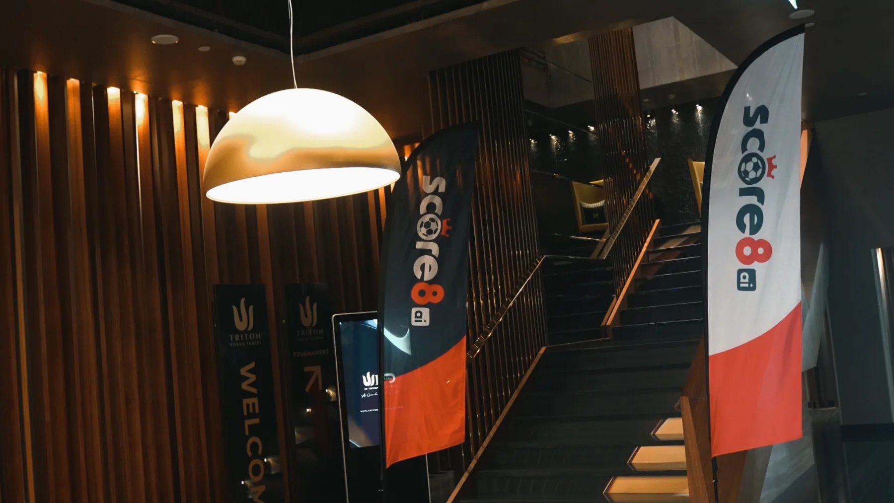 Score8 branding at an international event venue